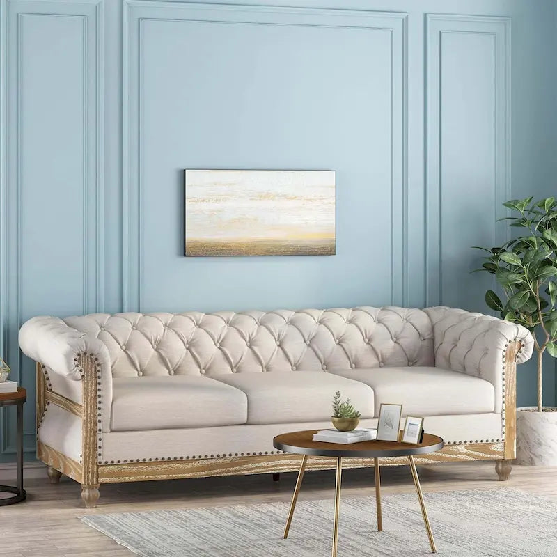Canapé 3 places chesterfield capitonné beige avec pieds en bois